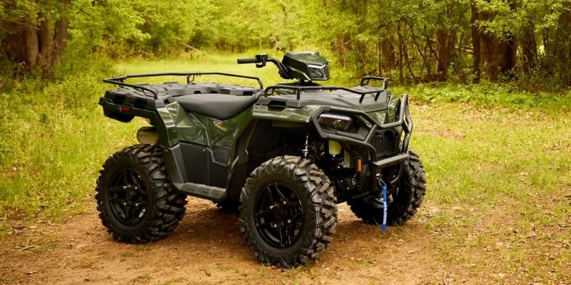 2026 Polaris Sportsman 570 40th Anniversary Edition in basalt rock terrain