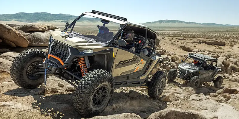Polaris RZR XP S rock crawling vs Sportsman 570 on forest trail